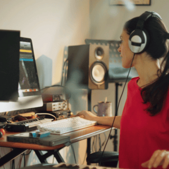 Woman in recording studio working on editing a song