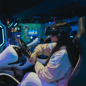 Person playing a VR driving video game