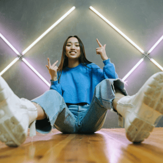Content creator posing on floor with dance moves