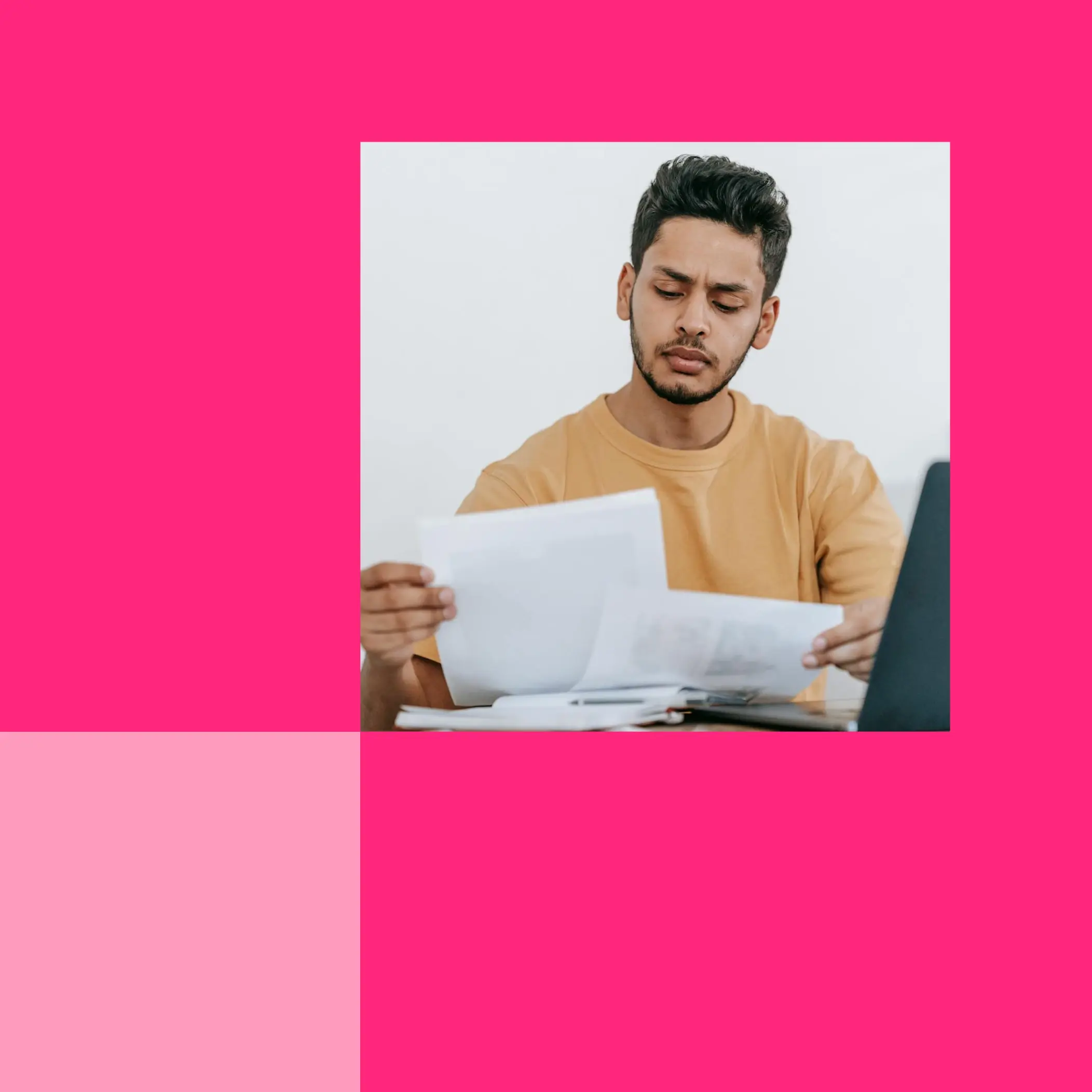 Man reviewing legal documents on a pink background